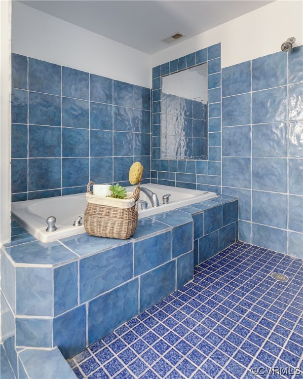 8312 Gwinnett Road Henrico, VA 23229 - Photo 28 of 50 a bathroom with a sink and a shower