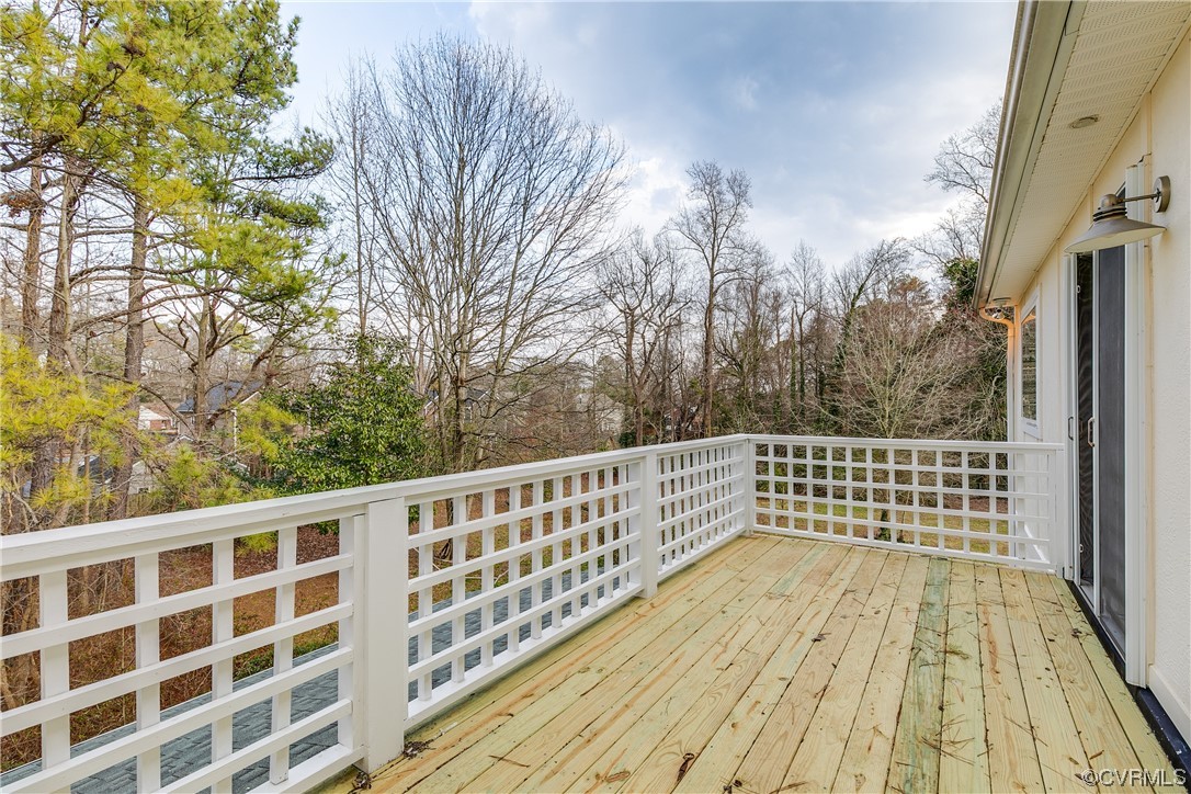 8312 Gwinnett Road Henrico, VA 23229 - Photo 31 of 50 a view of balcony with wooden floor and fence