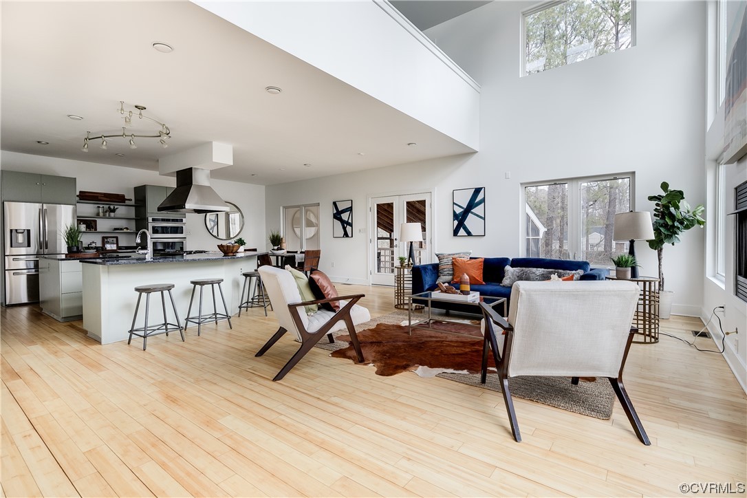 8312 Gwinnett Road Henrico, VA 23229 - Photo 8 of 50 a living room with furniture and a wooden floor