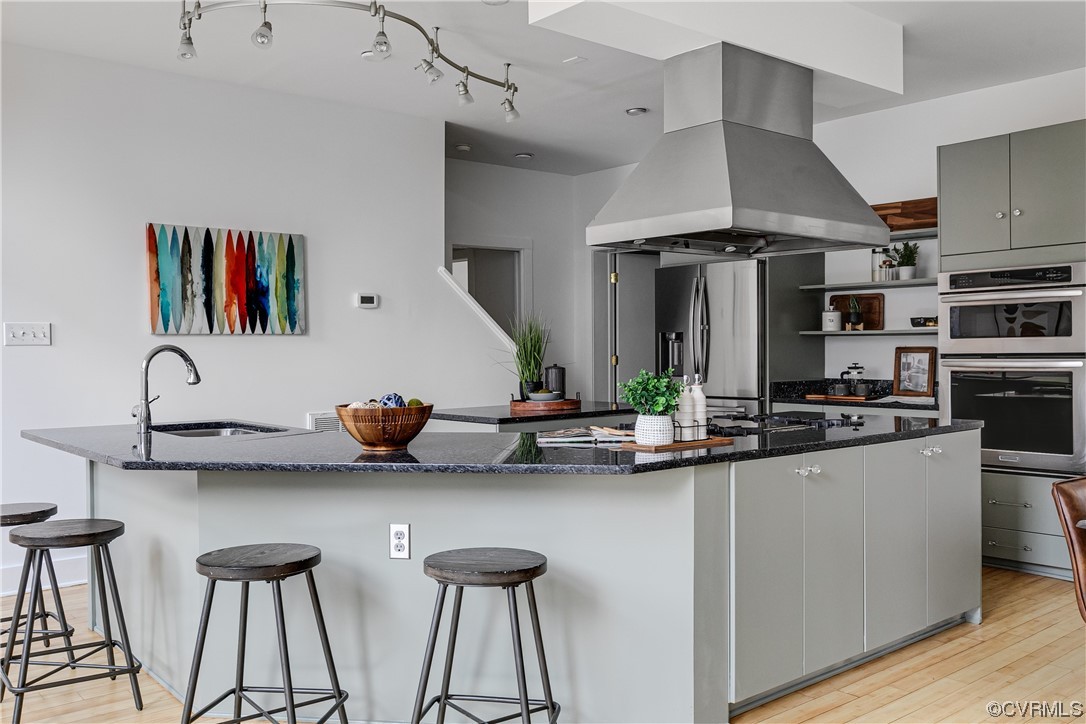 8312 Gwinnett Road Henrico, VA 23229 - Photo 10 of 50 a kitchen with stainless steel appliances a sink and a stove