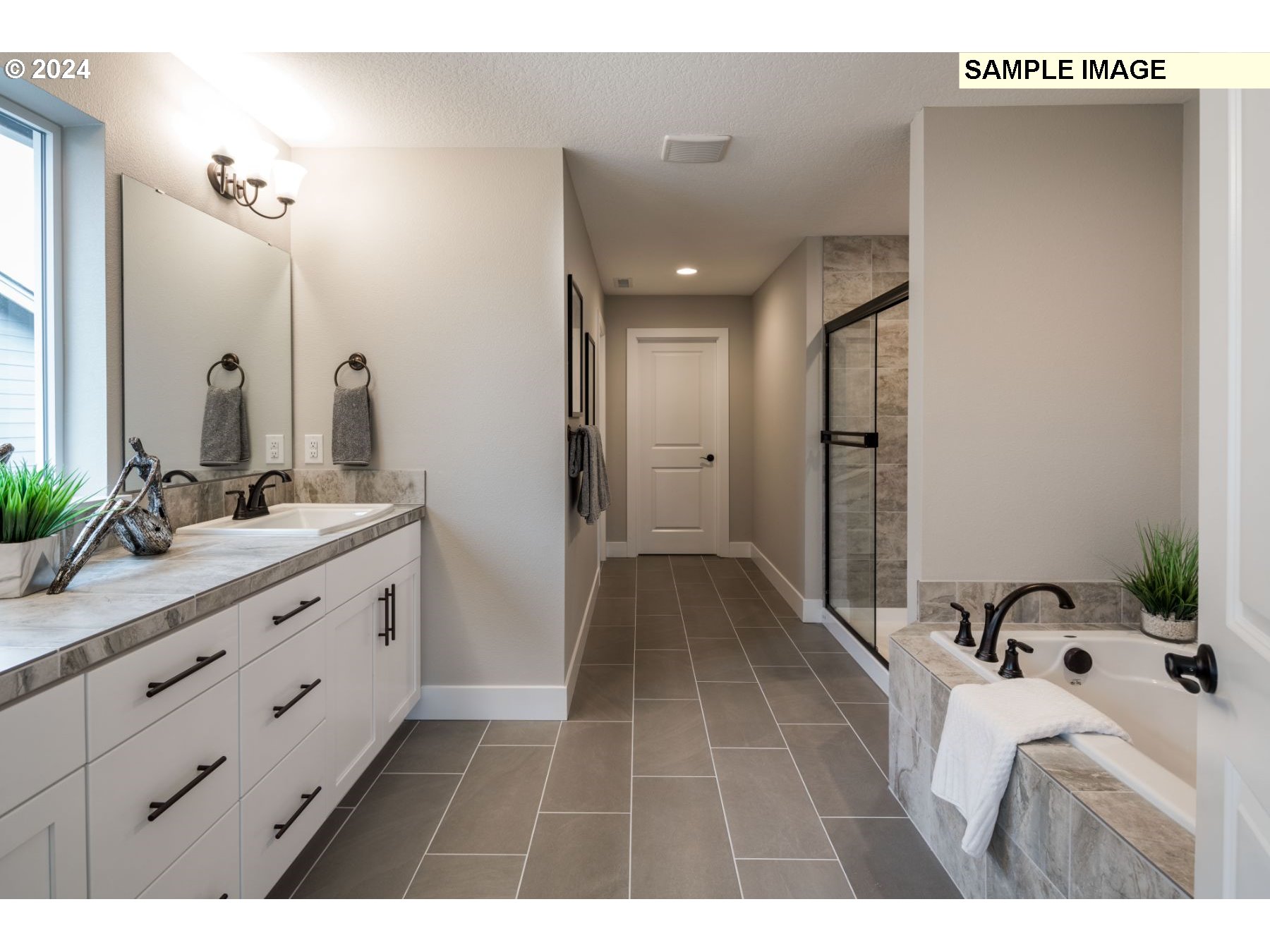 1018 South 46th Place Ridgefield, WA 98642 - Photo 13 of 34 a bathroom with a sink and mirror