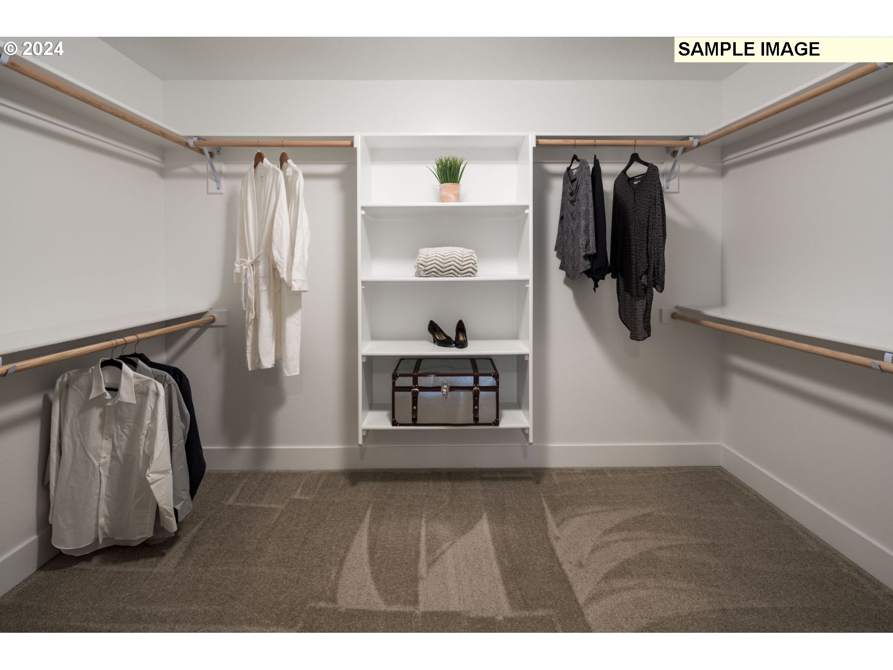1018 South 46th Place Ridgefield, WA 98642 - Photo 14 of 34 a view of walk in closet with clothes and shoes