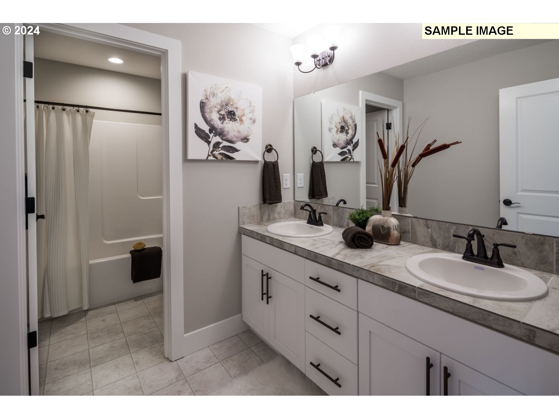 1018 South 46th Place Ridgefield, WA 98642 - Photo 16 of 34 a bathroom with a double vanity sink mirror and shower