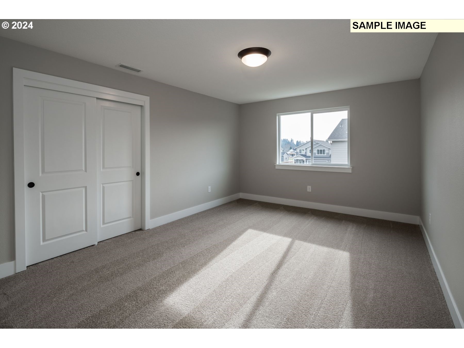 1018 South 46th Place Ridgefield, WA 98642 - Photo 18 of 34 a view of an empty room with a window