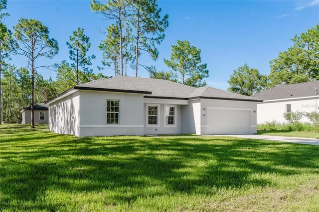 an aerial view of a house with a garden