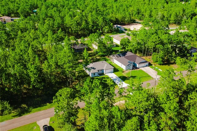 an aerial view of a house with a garden
