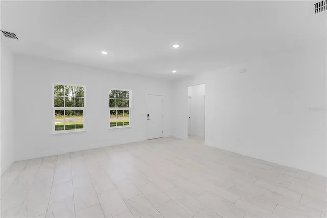 an empty room with windows