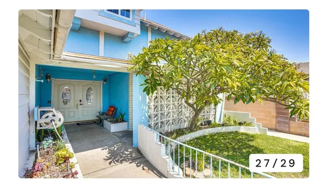 a view of a street with a building in the background