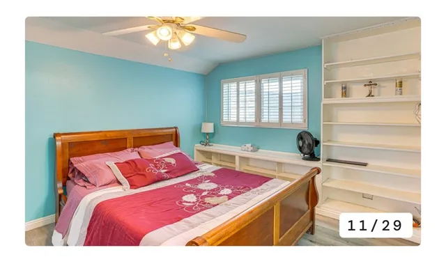 a bedroom with a bed and a coffee table