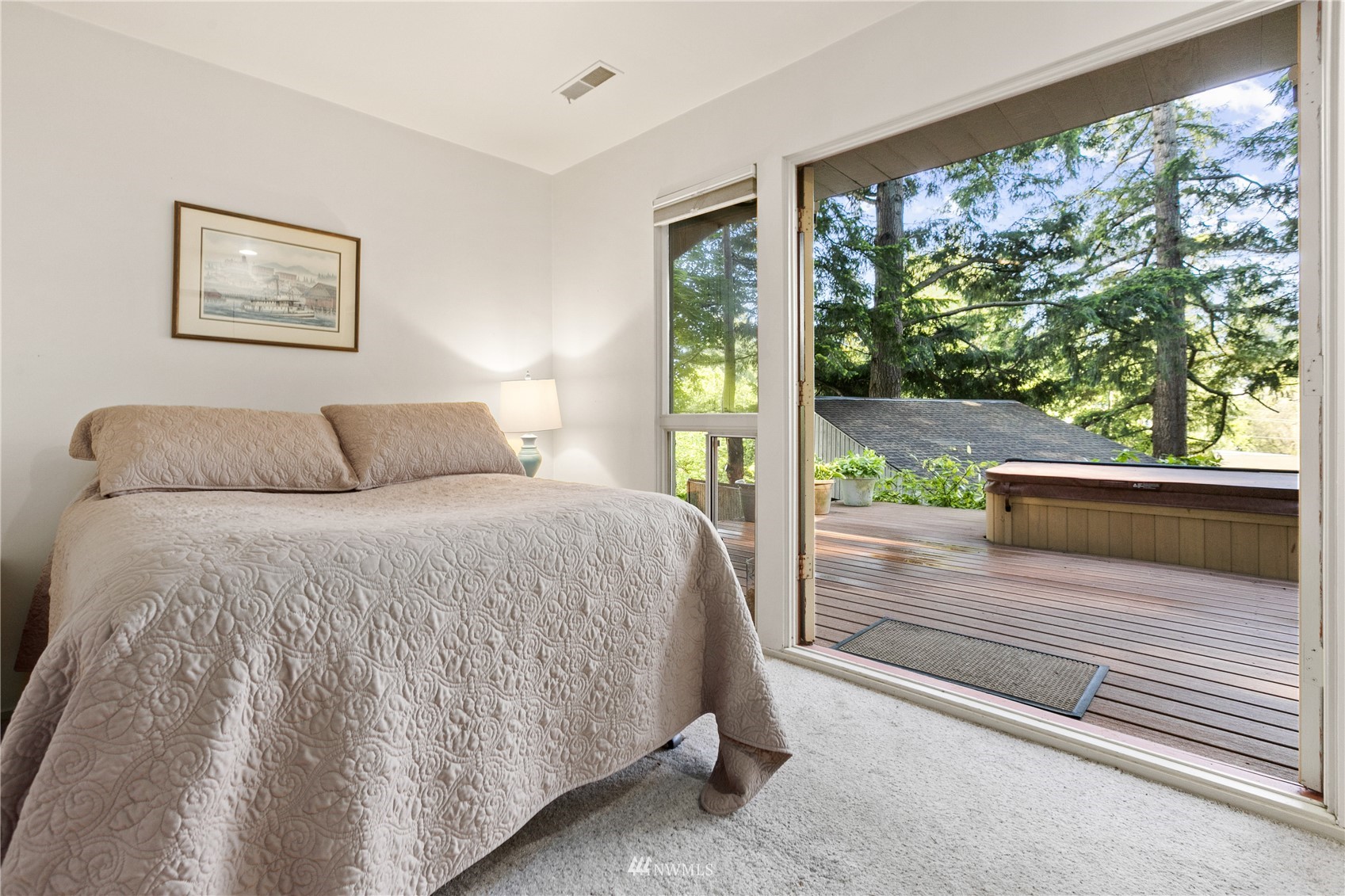 621 Willow Road Bellingham, WA 98225 - Photo 18 of 33 a bedroom with a large bed and a large window