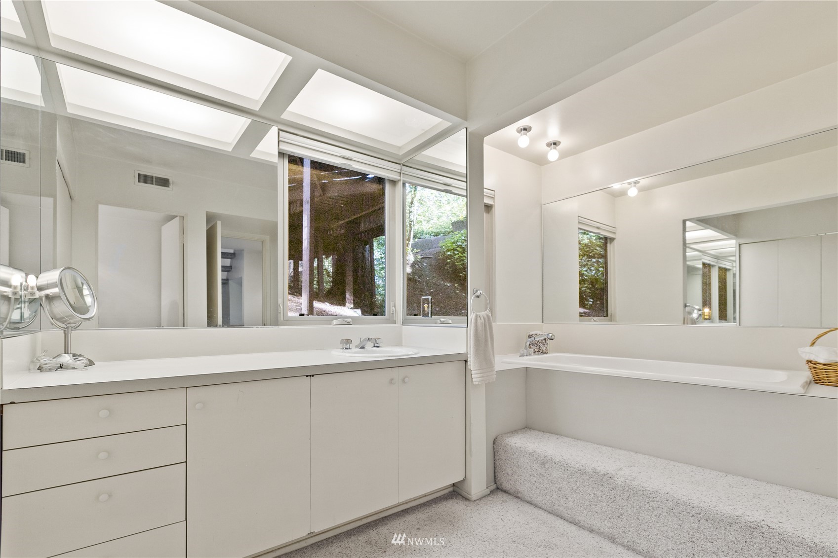 621 Willow Road Bellingham, WA 98225 - Photo 24 of 33 a bathroom with a sink double vanity mirror and bathtub