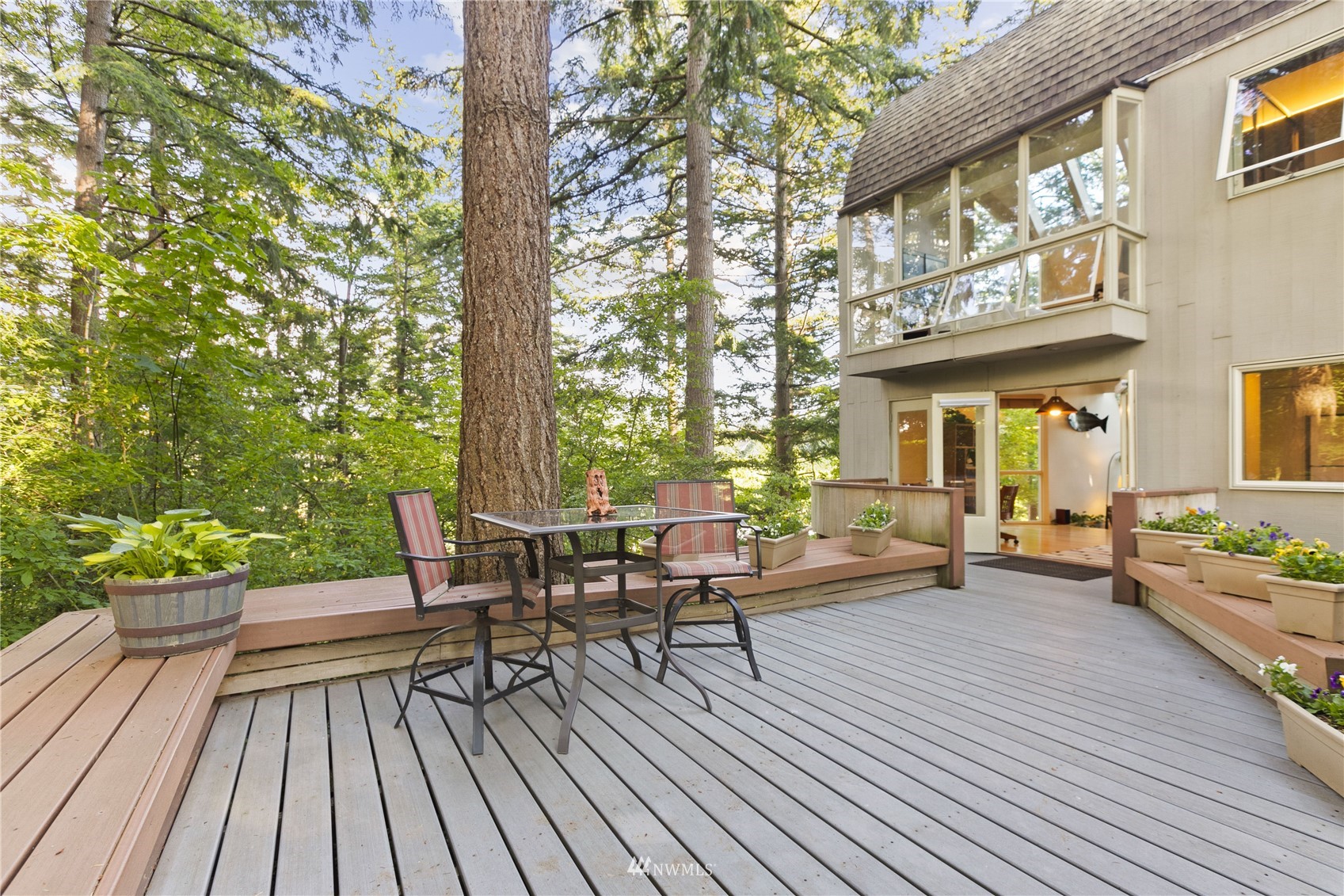 621 Willow Road Bellingham, WA 98225 - Photo 3 of 33 a view of a patio with couches table and chairs and potted plants