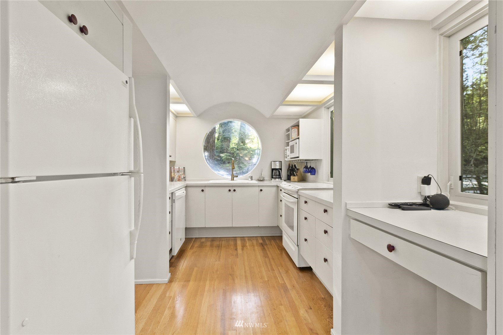 621 Willow Road Bellingham, WA 98225 - Photo 9 of 33 a kitchen with white cabinets and window
