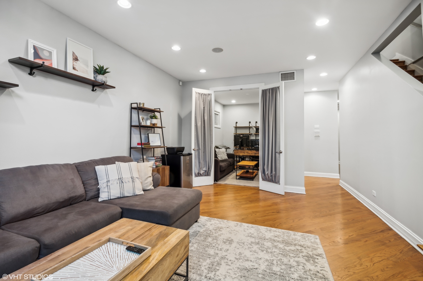 1131 West Addison Street, Unit 1 Chicago, IL 60613 - Photo 15 of 27 a living room with furniture and a flat screen tv