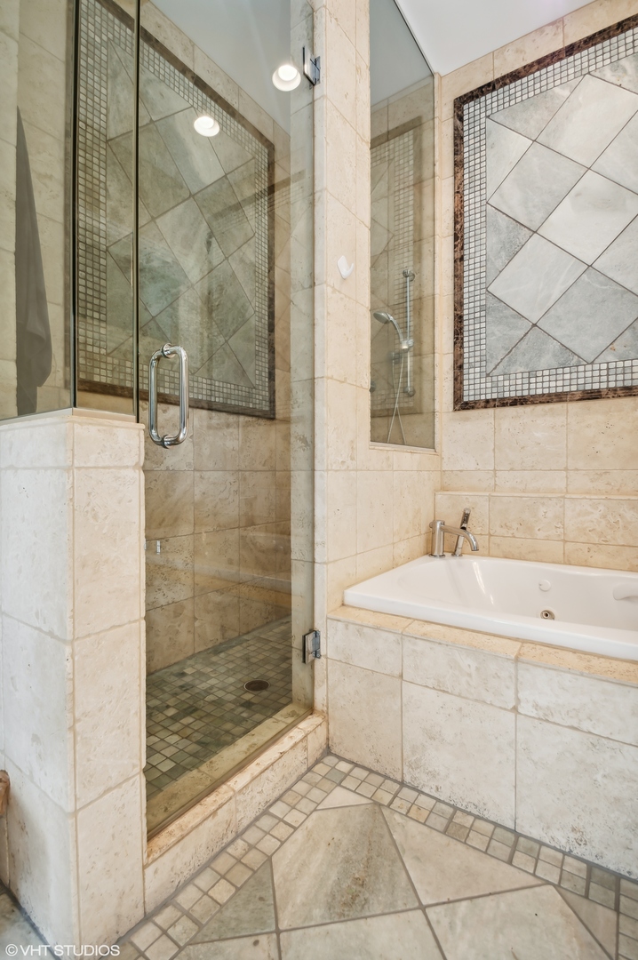 1131 West Addison Street, Unit 1 Chicago, IL 60613 - Photo 18 of 27 a bathroom with a sink and a mirror