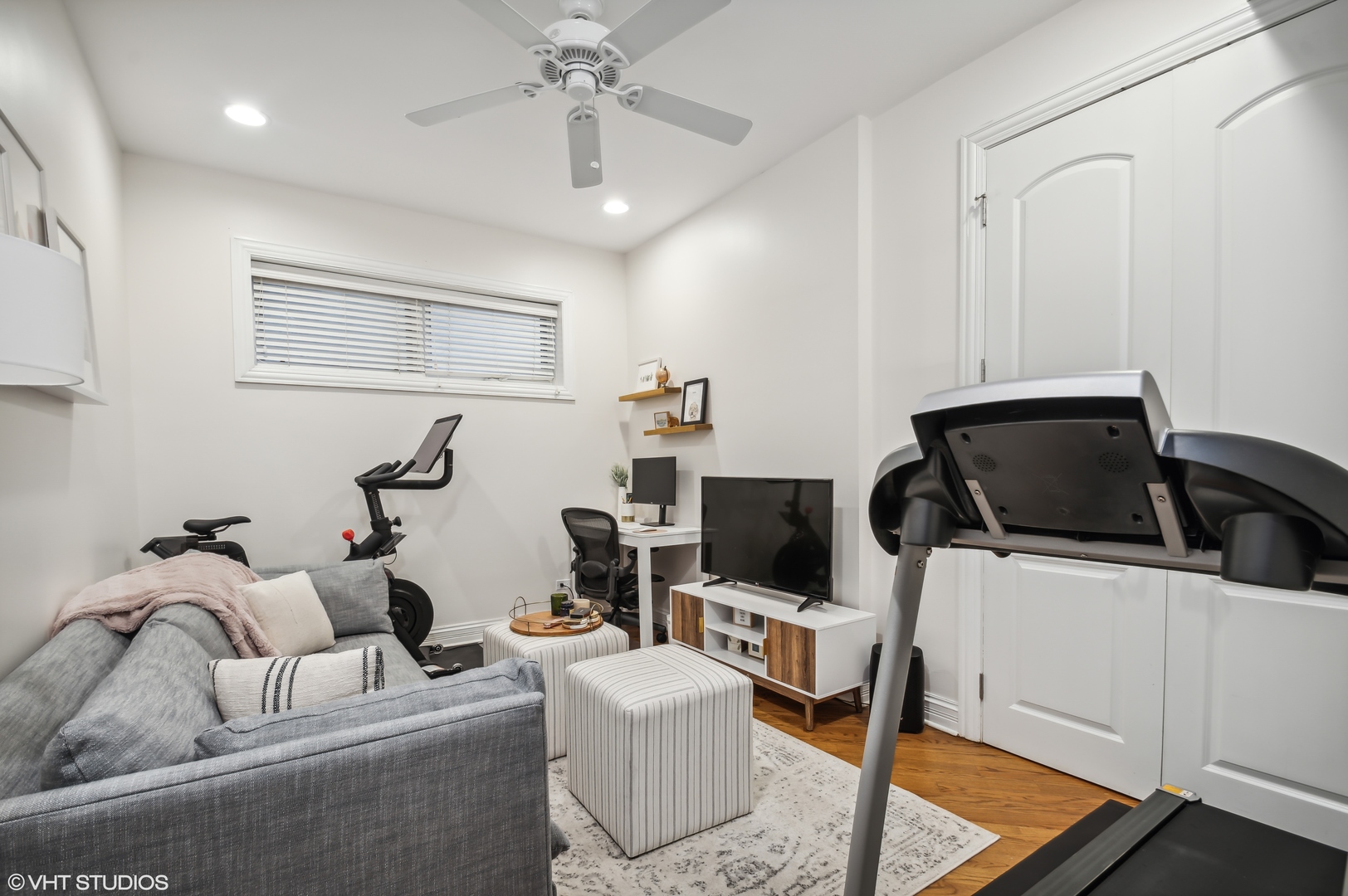 1131 West Addison Street, Unit 1 Chicago, IL 60613 - Photo 19 of 27 a living room with furniture and a flat screen tv