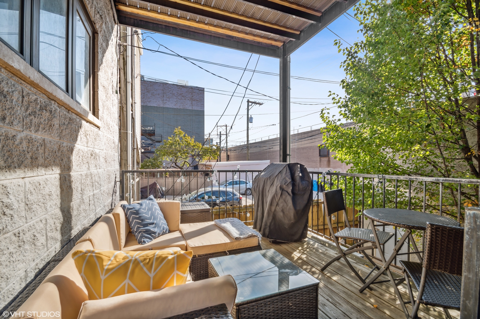 1131 West Addison Street, Unit 1 Chicago, IL 60613 - Photo 24 of 27 a view of a patio with couches chairs and potted plants
