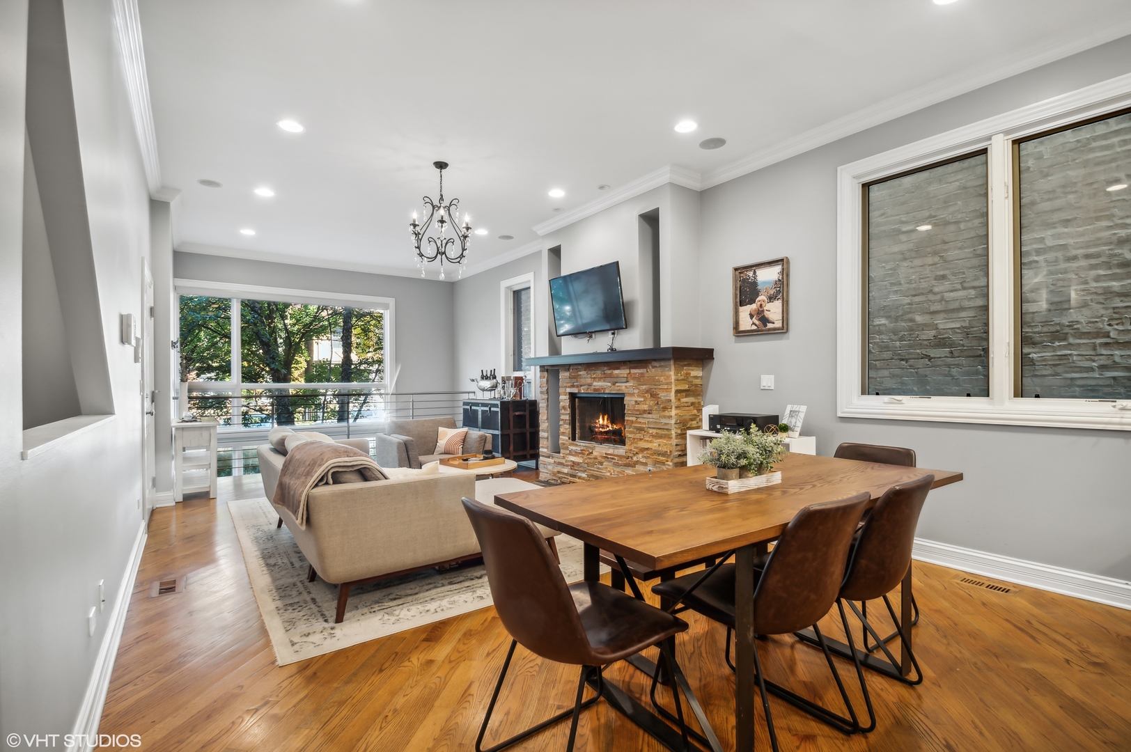 1131 West Addison Street, Unit 1 Chicago, IL 60613 - Photo 6 of 27 a view of a dining room with furniture window and wooden floor