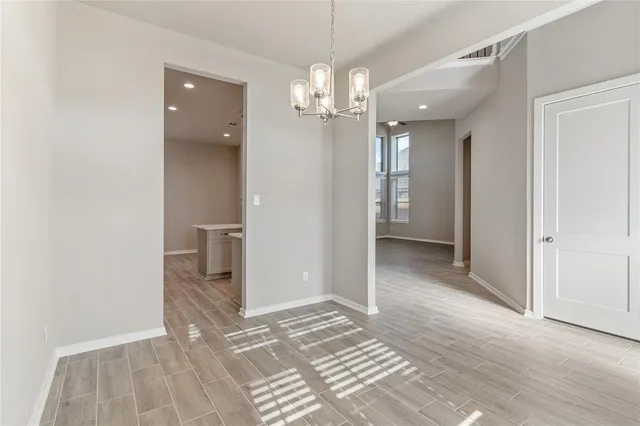 wooden floor in a room with a bathroom