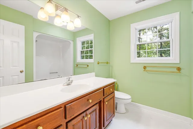 an aerial view of a house with a yard and garden