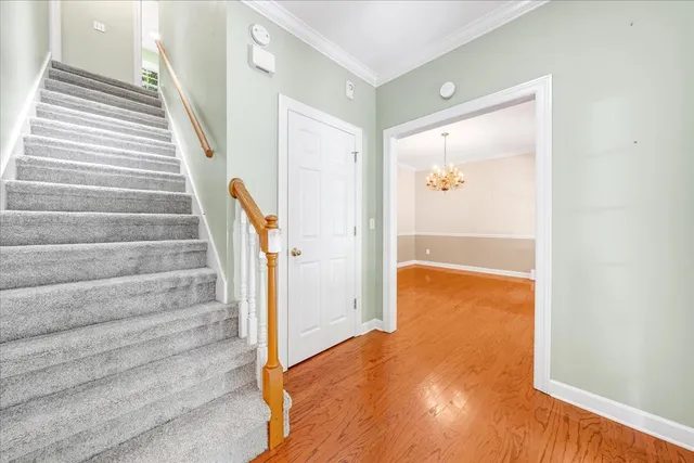 a large kitchen with stainless steel appliances granite countertop a large window a sink and cabinets