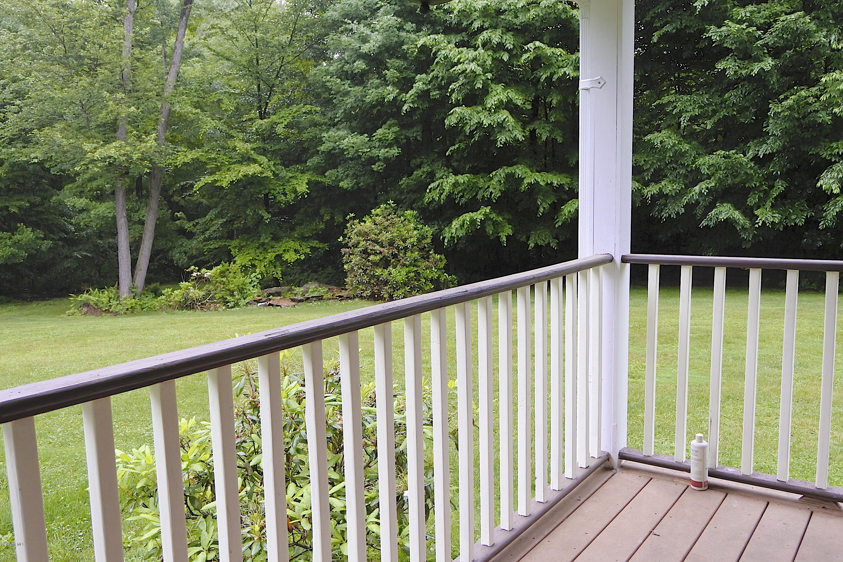 24 Housatonnuck Road Stockbridge, MA 01262 - Photo 18 of 36 a view of a roof deck with wooden floor and fence