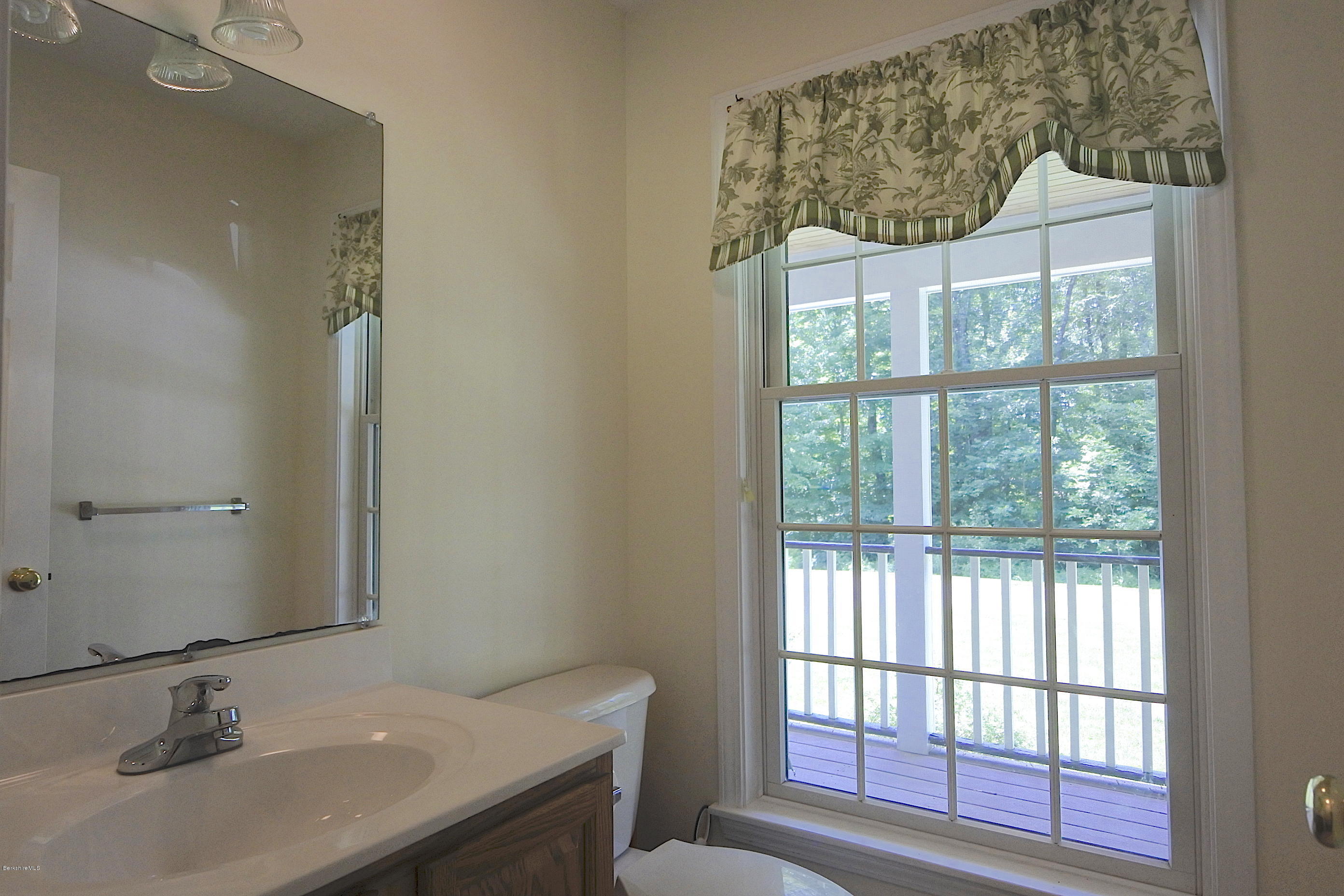 24 Housatonnuck Road Stockbridge, MA 01262 - Photo 20 of 36 a bathroom with a sink and a toilet