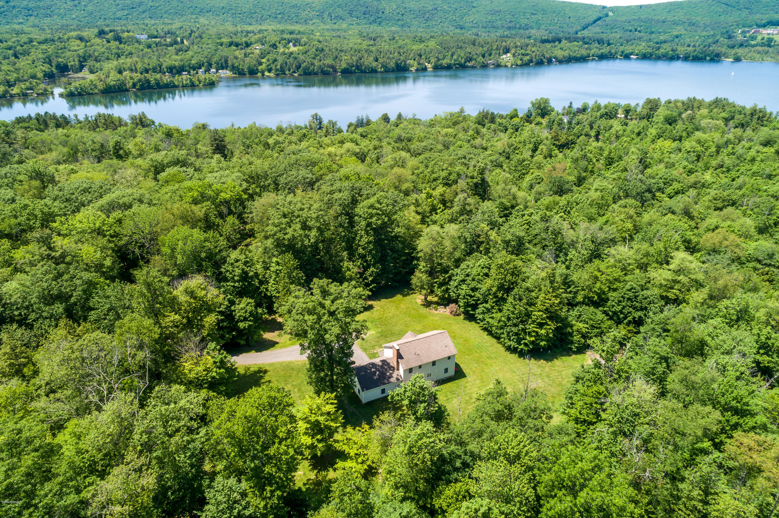 24 Housatonnuck Road Stockbridge, MA 01262 - Photo 3 of 36 an aerial view of a house with a yard and lake view