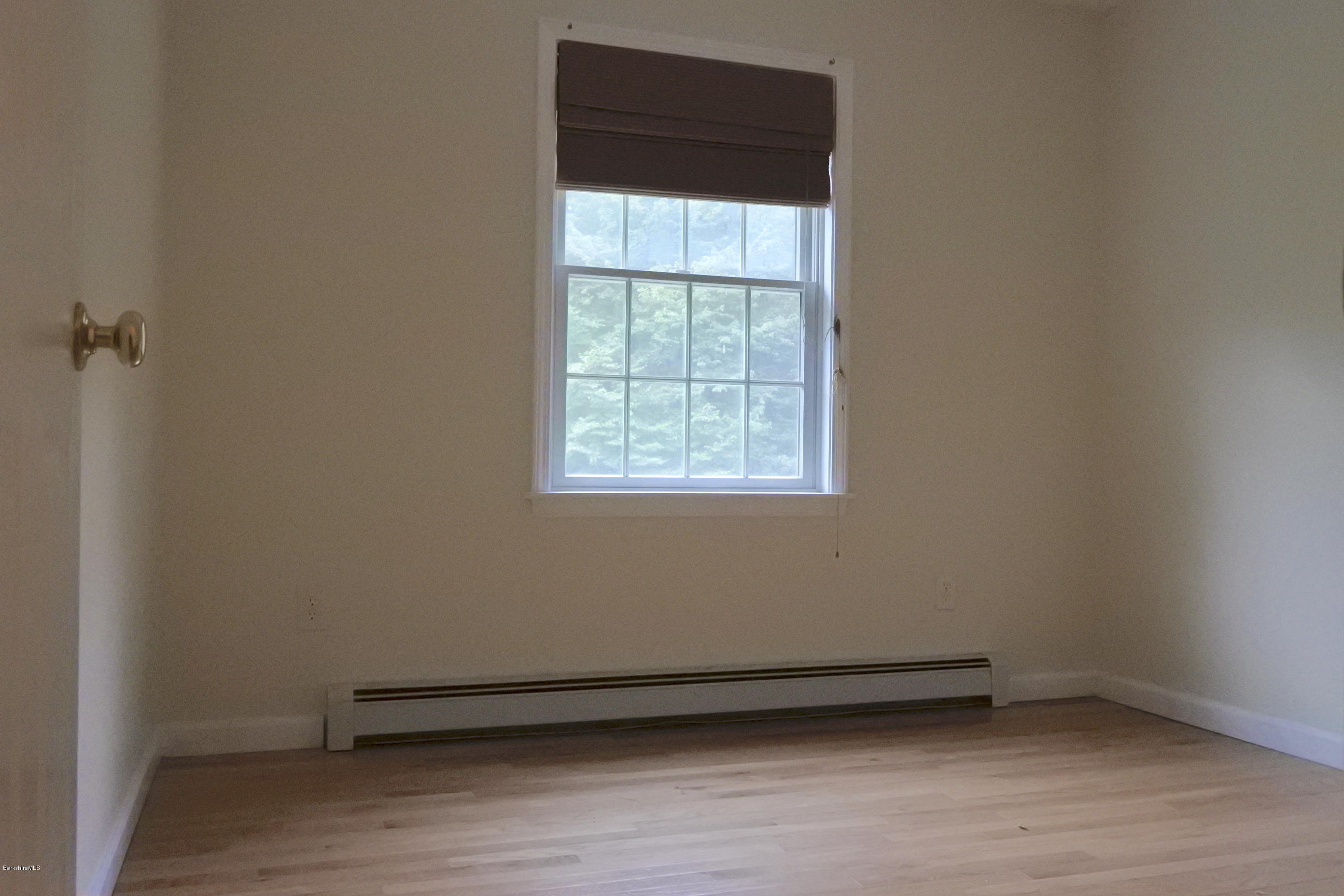 24 Housatonnuck Road Stockbridge, MA 01262 - Photo 23 of 36 a view of a small space with wooden floor and a window