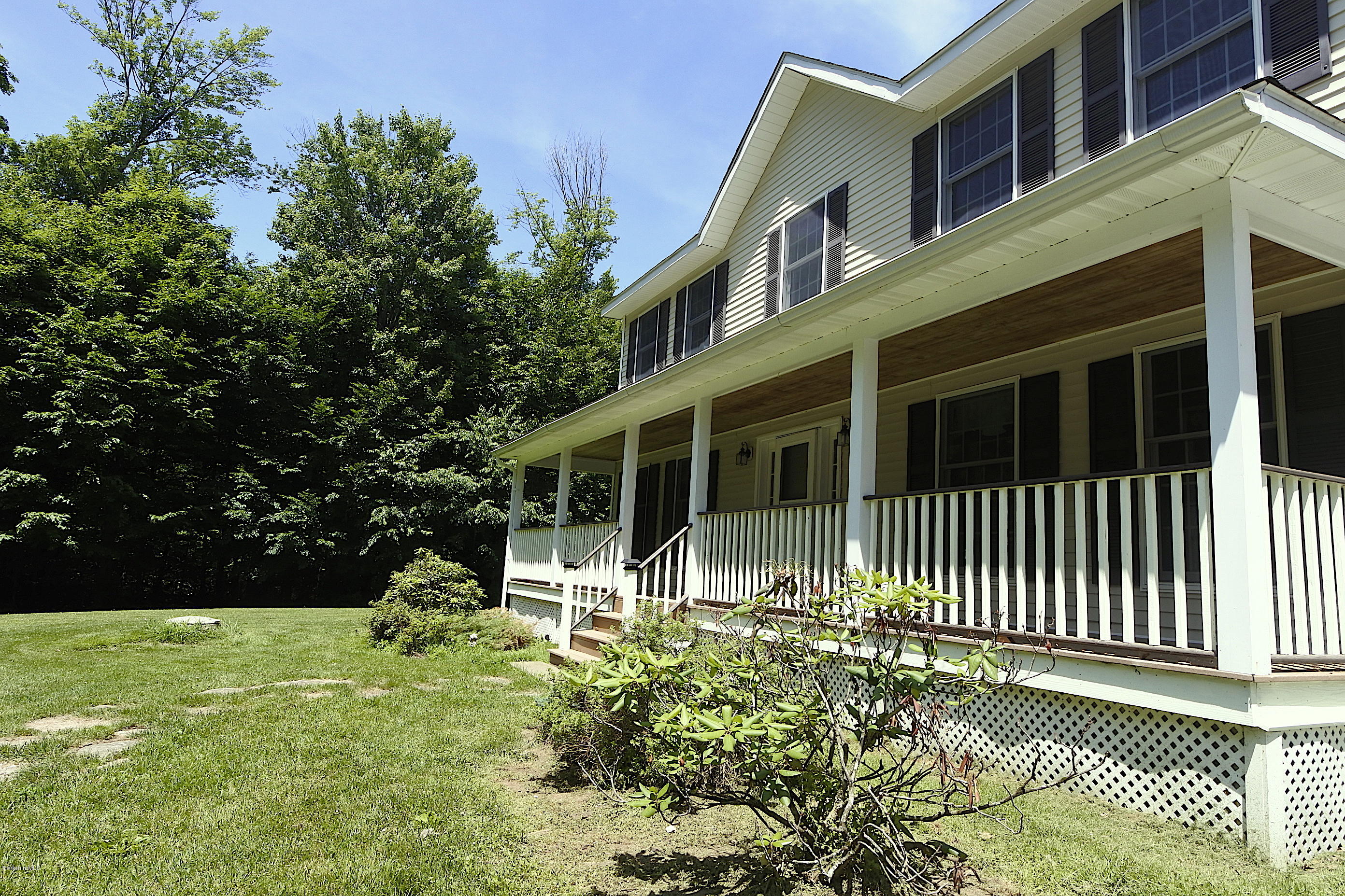 24 Housatonnuck Road Stockbridge, MA 01262 - Photo 28 of 36 a view of a house with a yard
