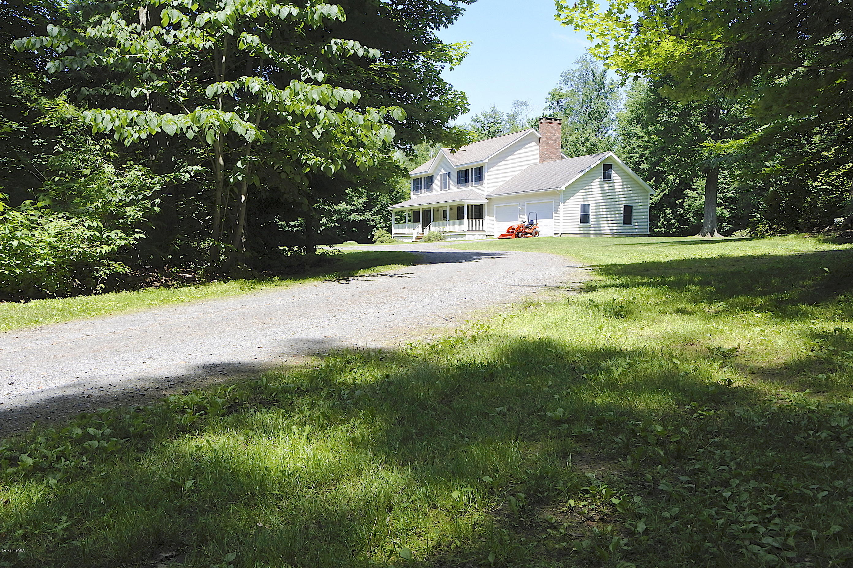 24 Housatonnuck Road Stockbridge, MA 01262 - Photo 33 of 36 a view of house with garden and trees