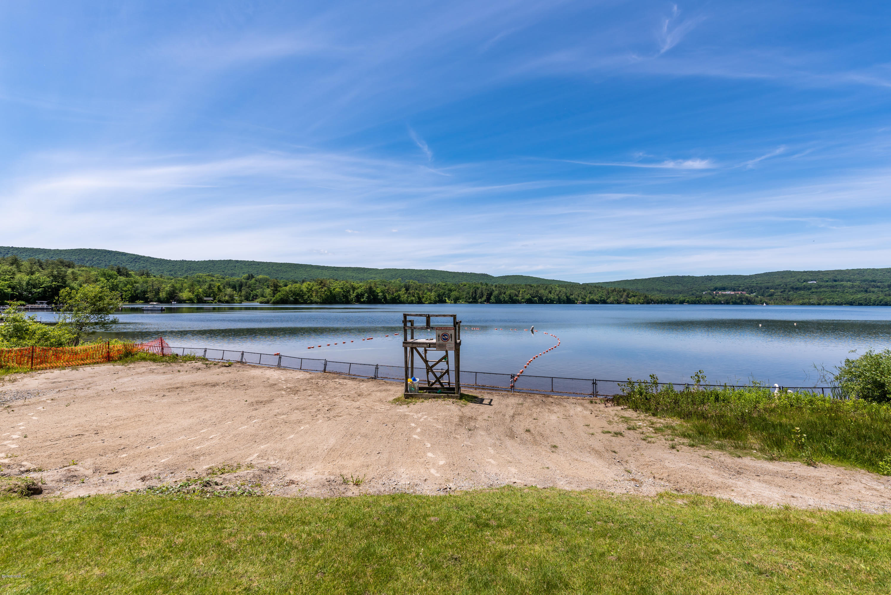 24 Housatonnuck Road Stockbridge, MA 01262 - Photo 36 of 36 a view of a lake with houses in the back