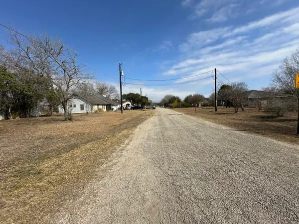 a view of a road with a building in the background