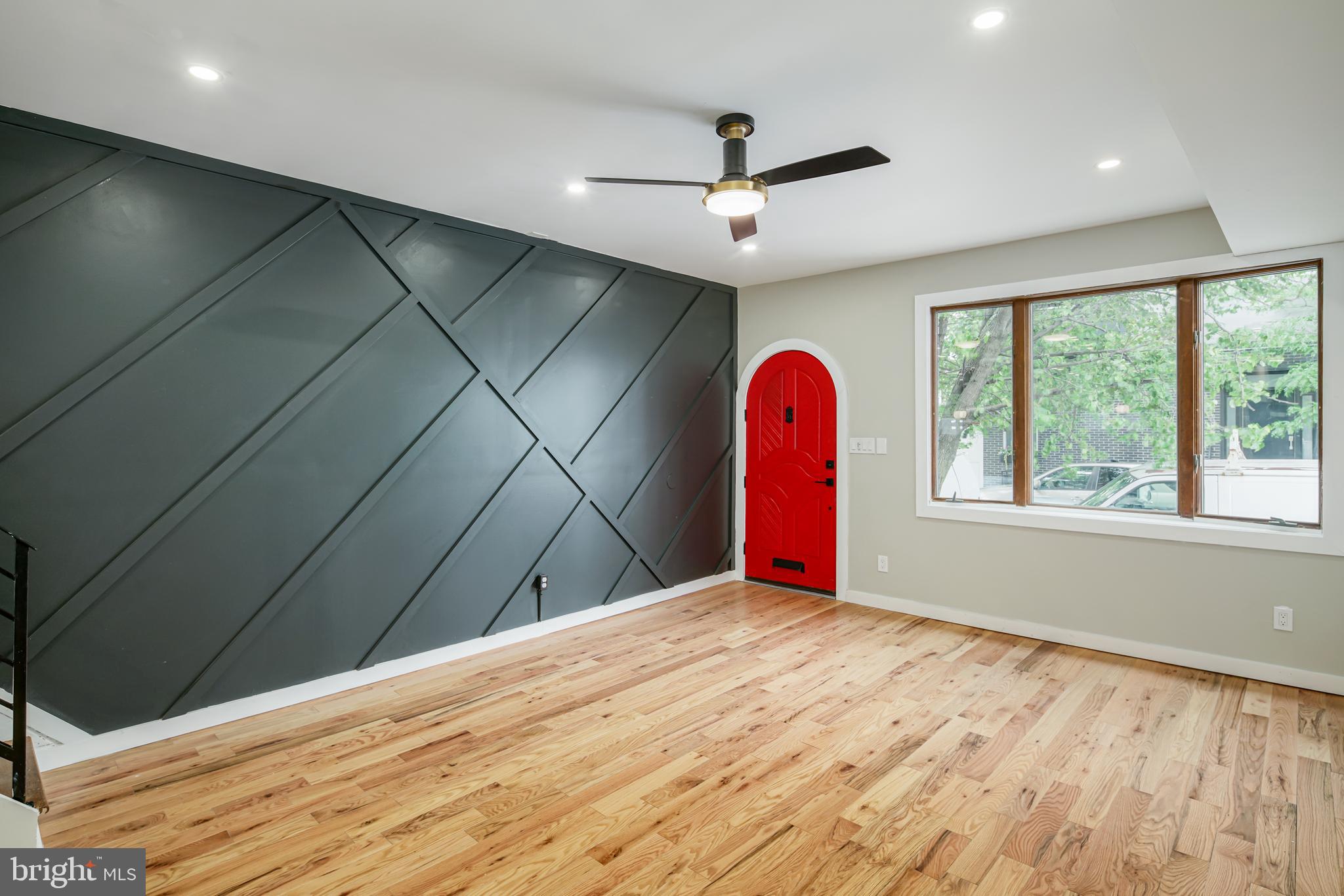 1129 South 12th Street Philadelphia, PA 19147 - Photo 11 of 24 a view of a livingroom with a ceiling fan and window