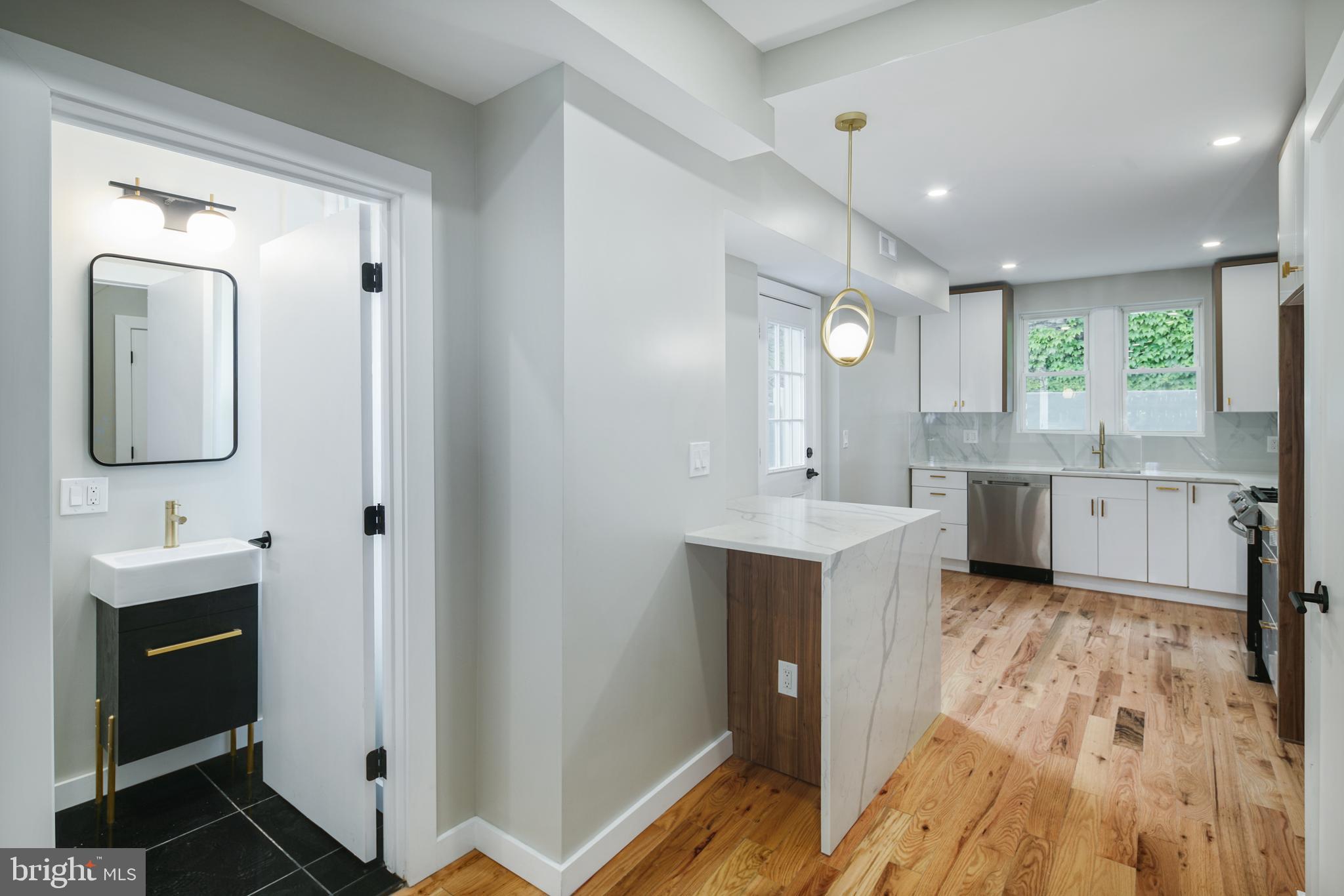 1129 South 12th Street Philadelphia, PA 19147 - Photo 12 of 24 a view of a kitchen from the hallway