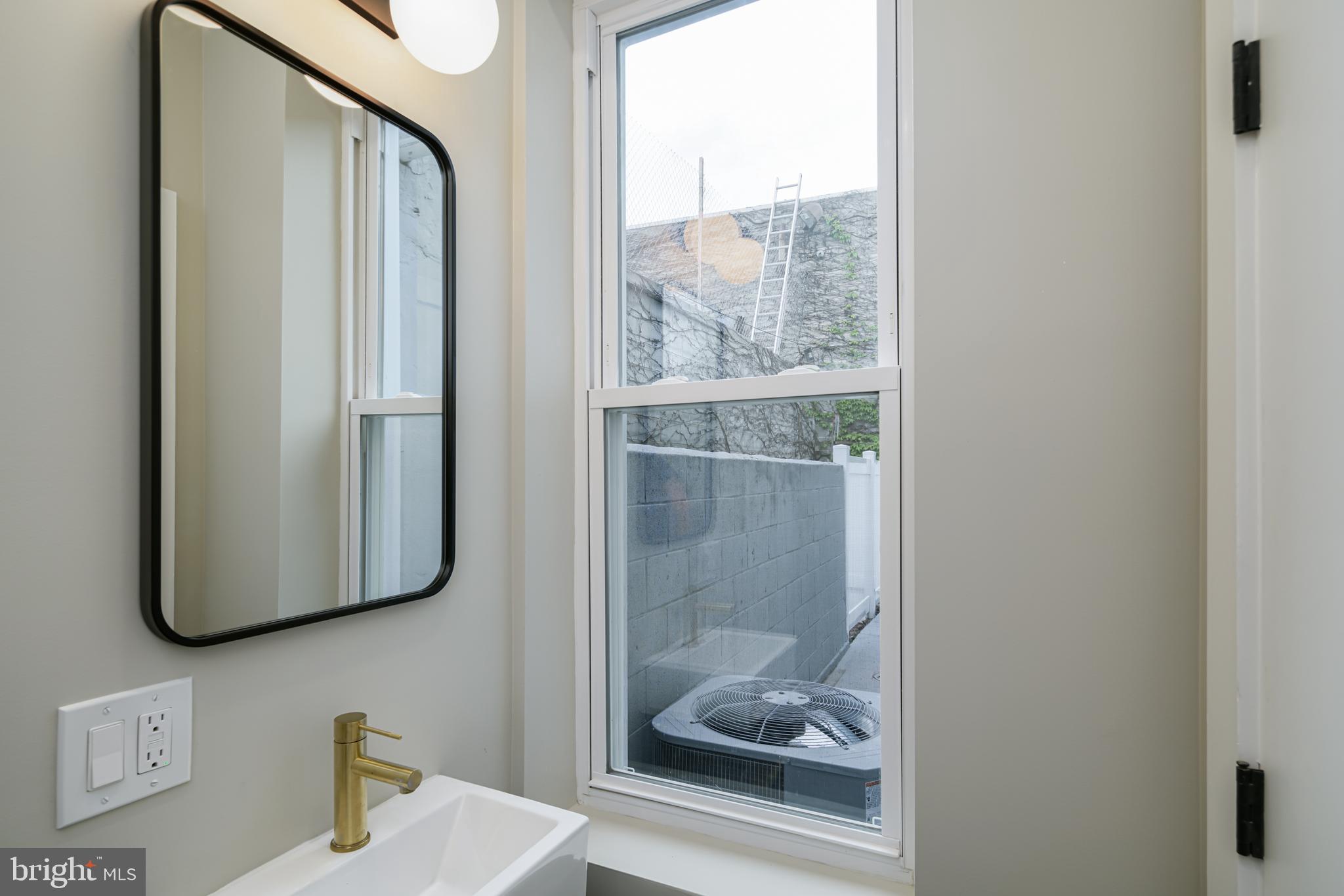 1129 South 12th Street Philadelphia, PA 19147 - Photo 14 of 24 a bathroom with a shower and a mirror