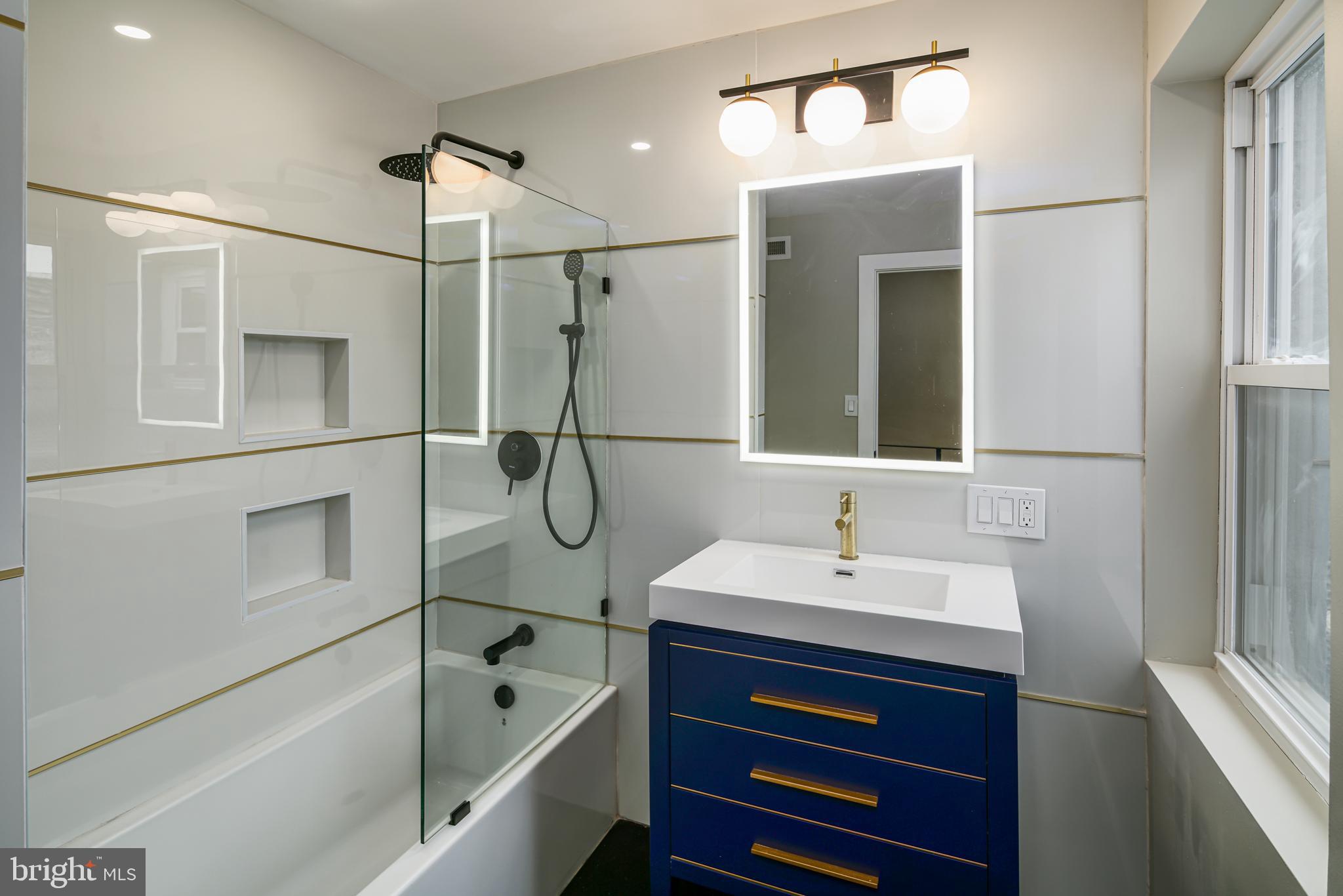 1129 South 12th Street Philadelphia, PA 19147 - Photo 16 of 24 a bathroom with a sink and a mirror