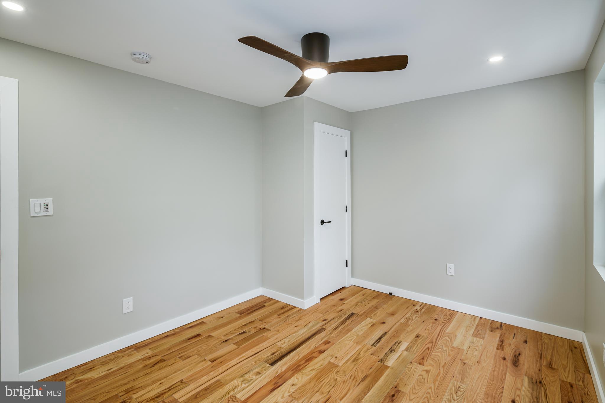 1129 South 12th Street Philadelphia, PA 19147 - Photo 18 of 24 a view of a room with wooden floor and a ceiling fan