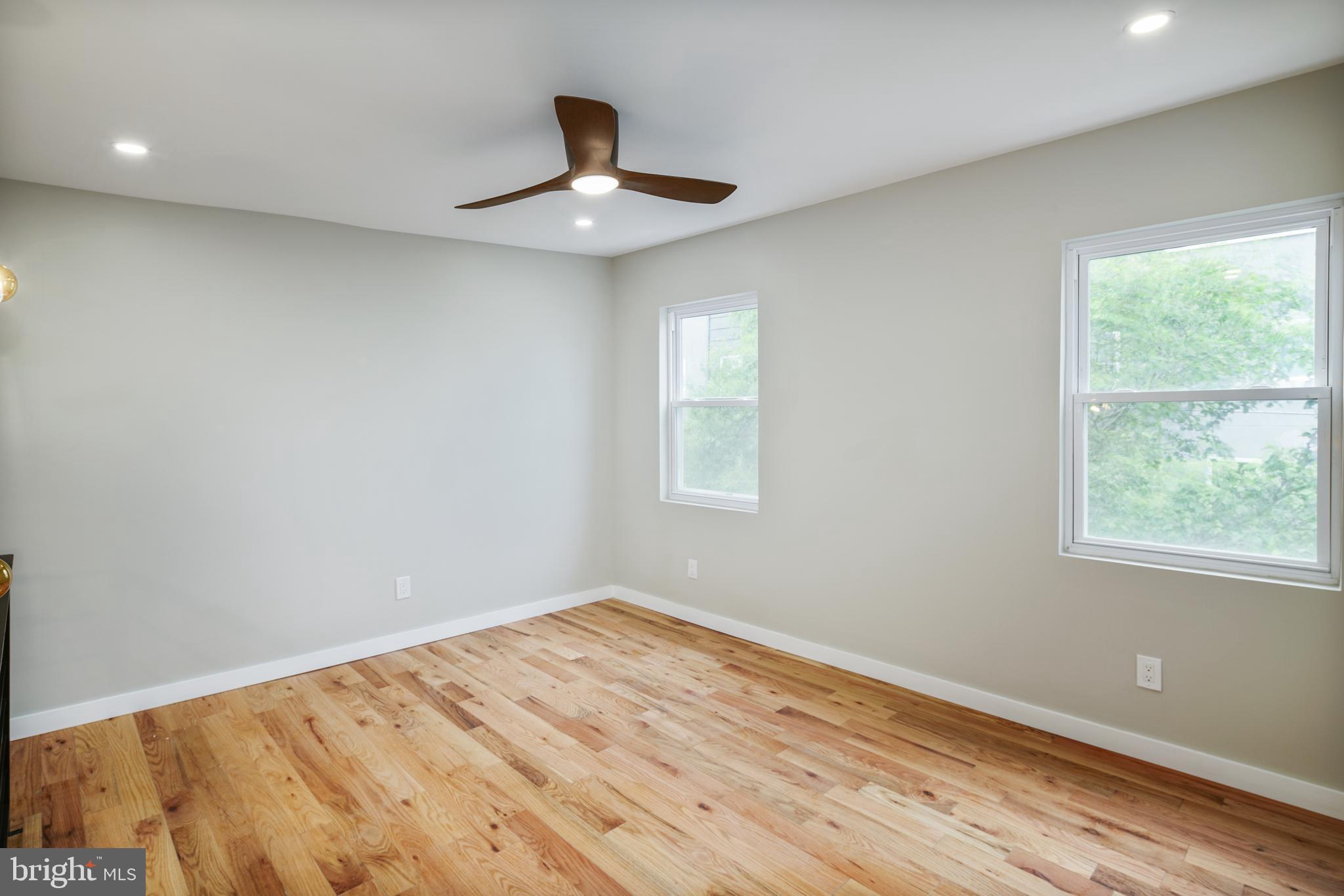 1129 South 12th Street Philadelphia, PA 19147 - Photo 20 of 24 a view of empty room with wooden floor and fan