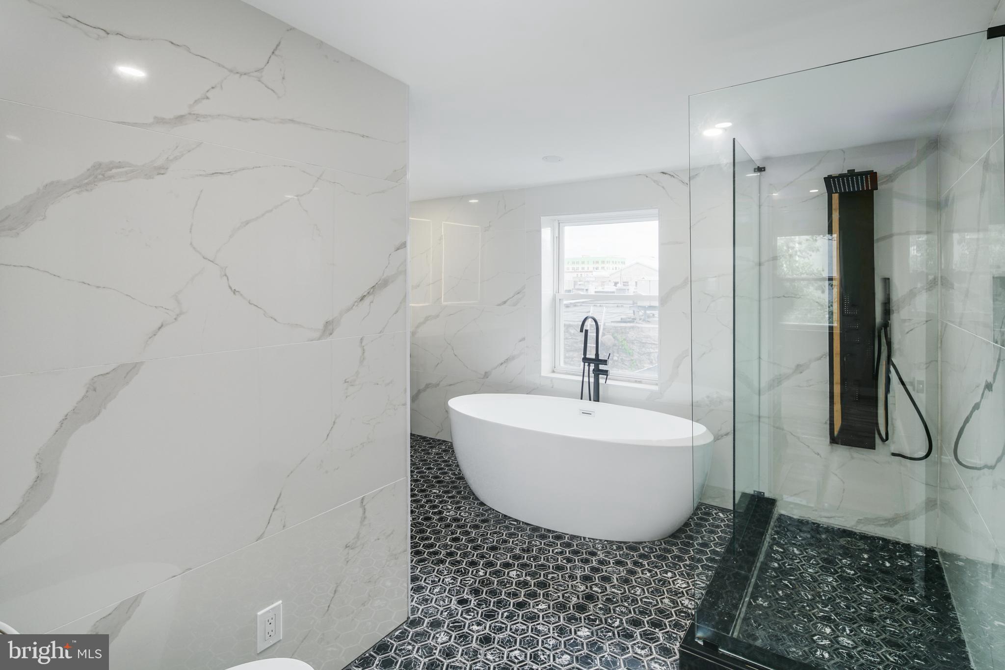 1129 South 12th Street Philadelphia, PA 19147 - Photo 22 of 24 a bathroom with a sink toilet and shower