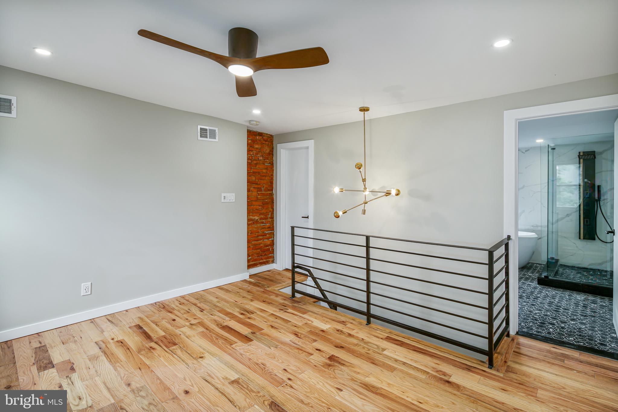 1129 South 12th Street Philadelphia, PA 19147 - Photo 5 of 24 a view of a hallway with closet and wooden floor