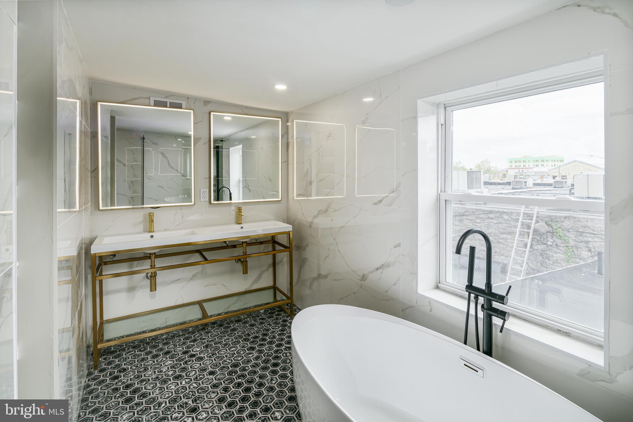 1129 South 12th Street Philadelphia, PA 19147 - Photo 6 of 24 a bathroom with a sink and a mirror