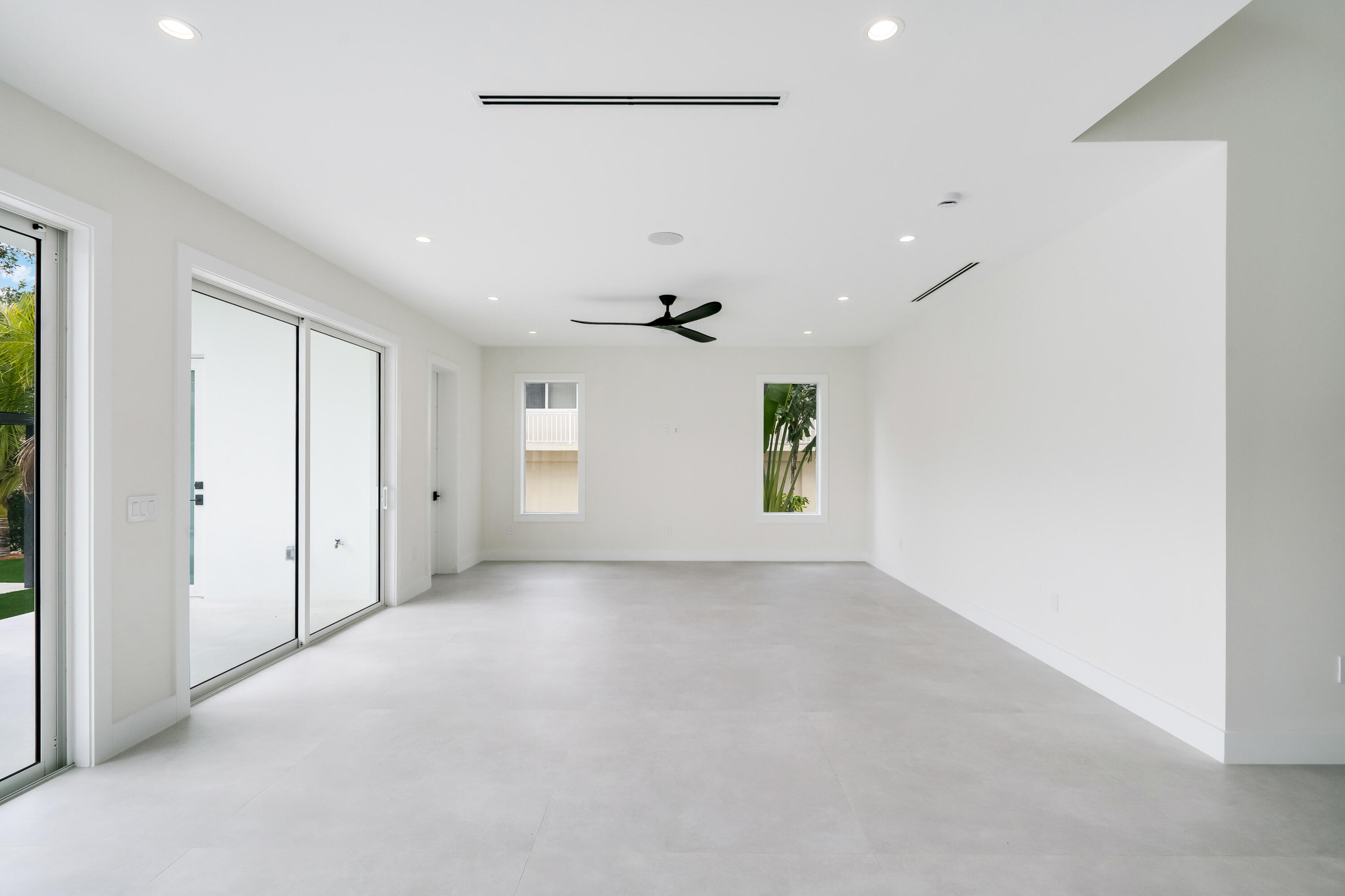 115 Spoonbill Road Tavernier, FL 33070 - Photo 11 of 85 wooden floor in an empty room with a window