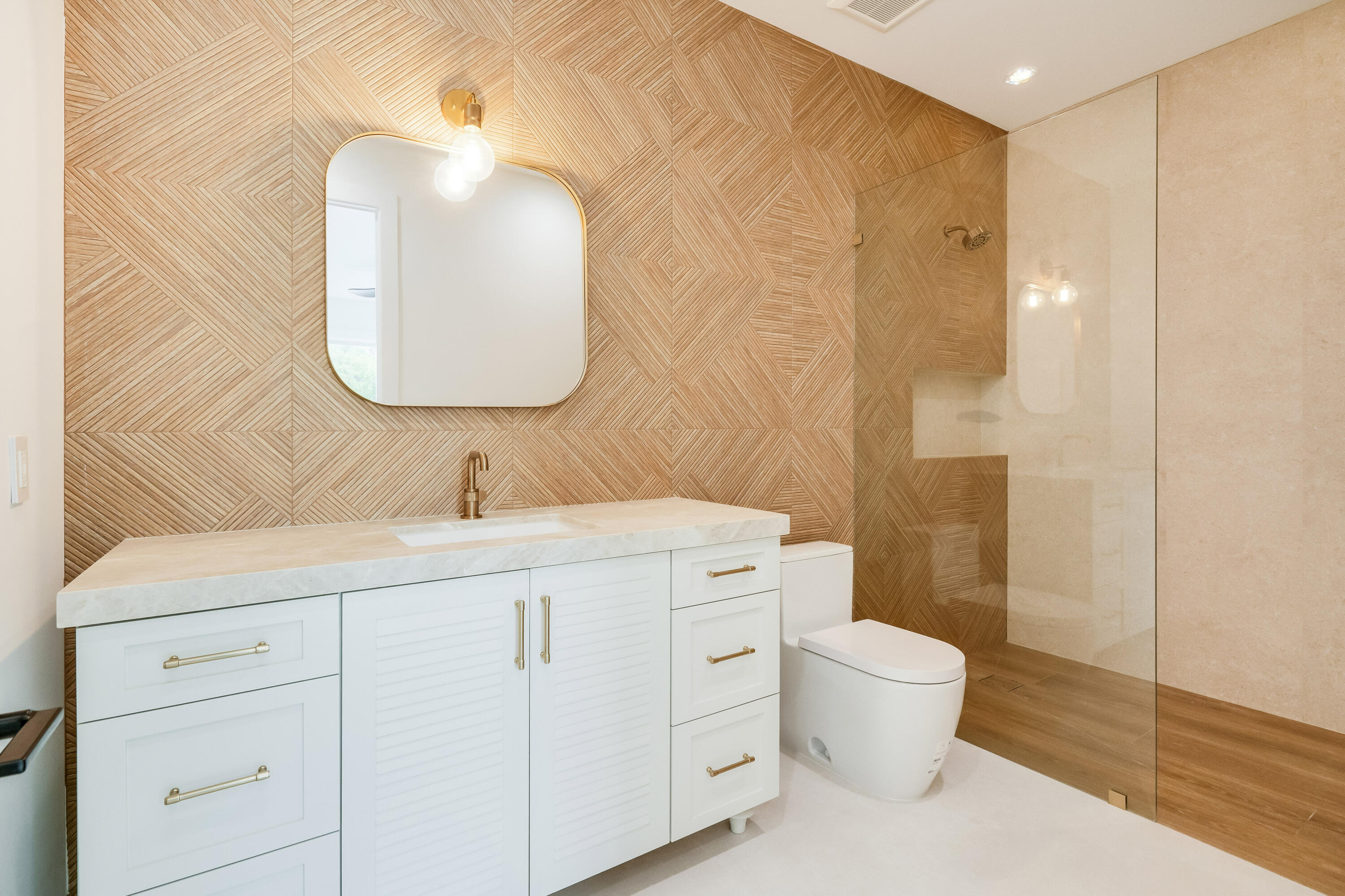 115 Spoonbill Road Tavernier, FL 33070 - Photo 23 of 85 a bathroom with a sink a toilet and a mirror