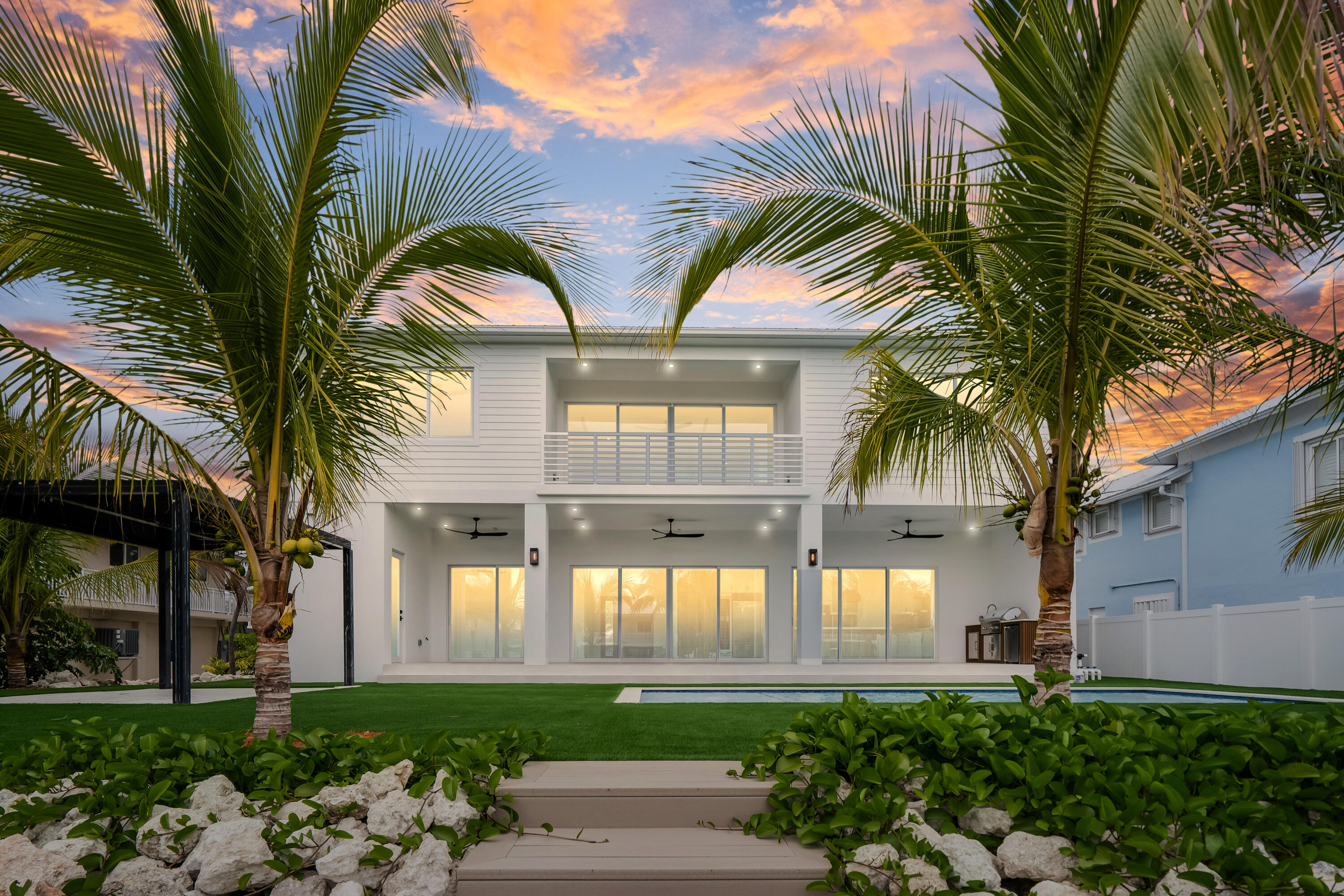 115 Spoonbill Road Tavernier, FL 33070 - Photo 4 of 85 a front view of a house with a garden