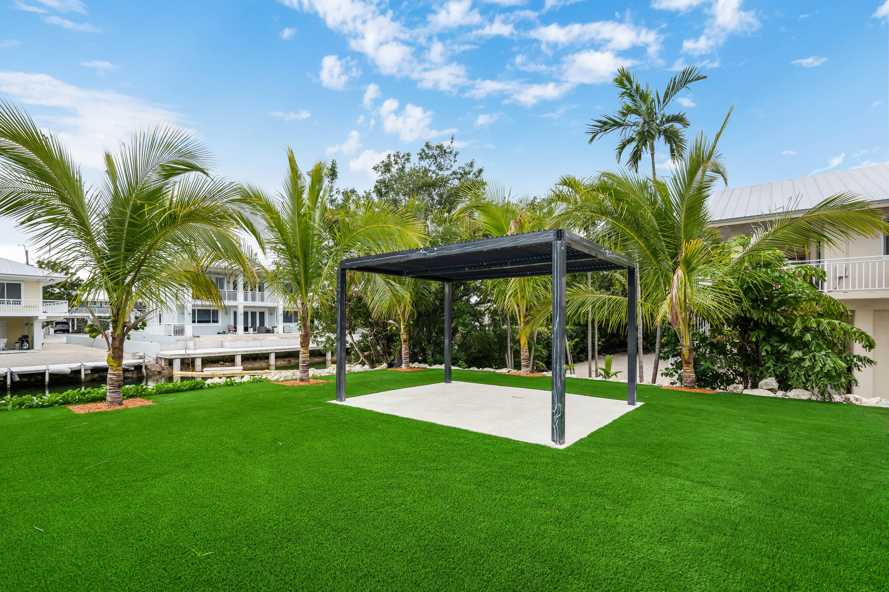 115 Spoonbill Road Tavernier, FL 33070 - Photo 64 of 85 a view of a house with a backyard porch and sitting area
