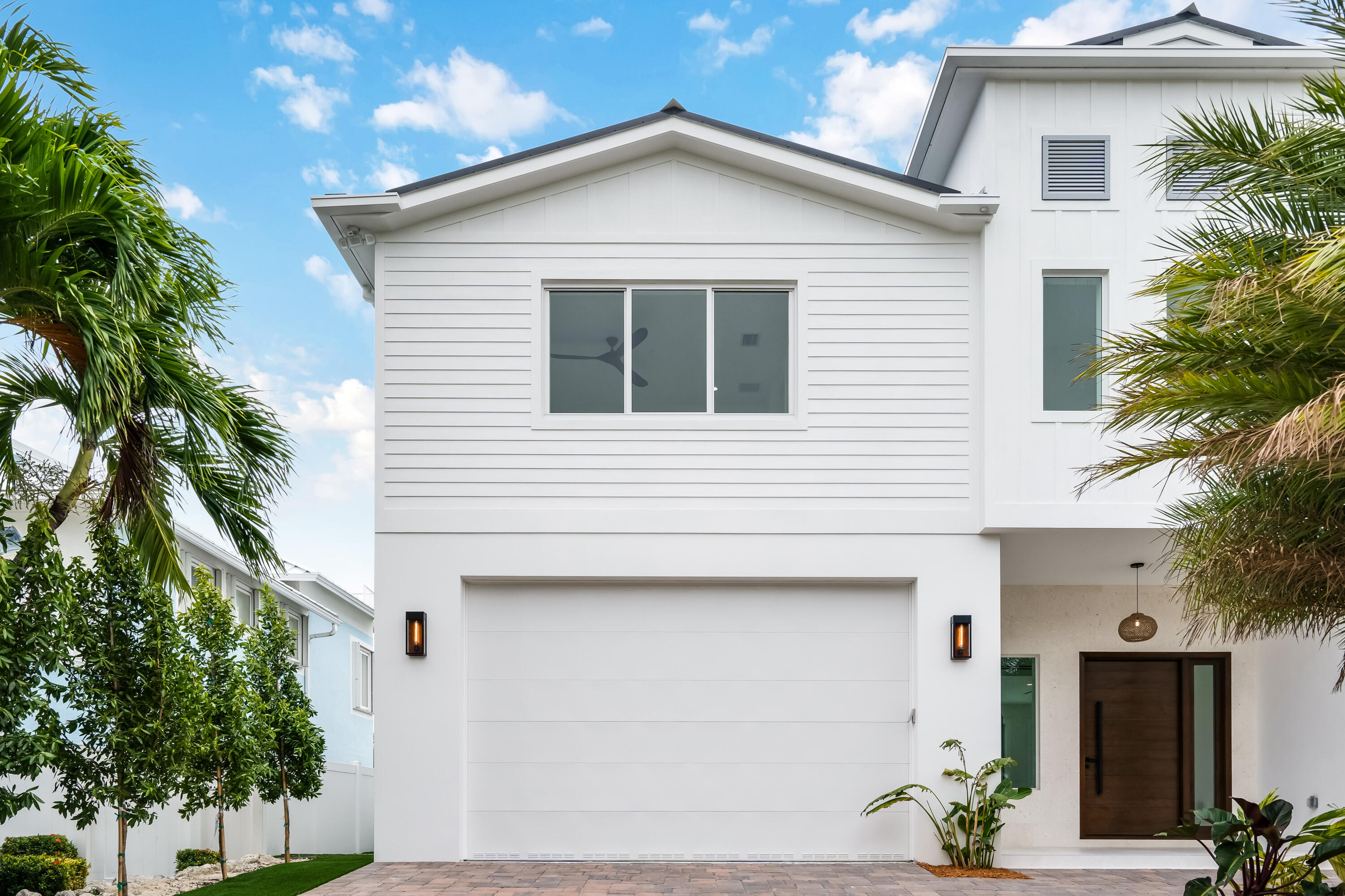 115 Spoonbill Road Tavernier, FL 33070 - Photo 83 of 85 a view of a white house next to a yard