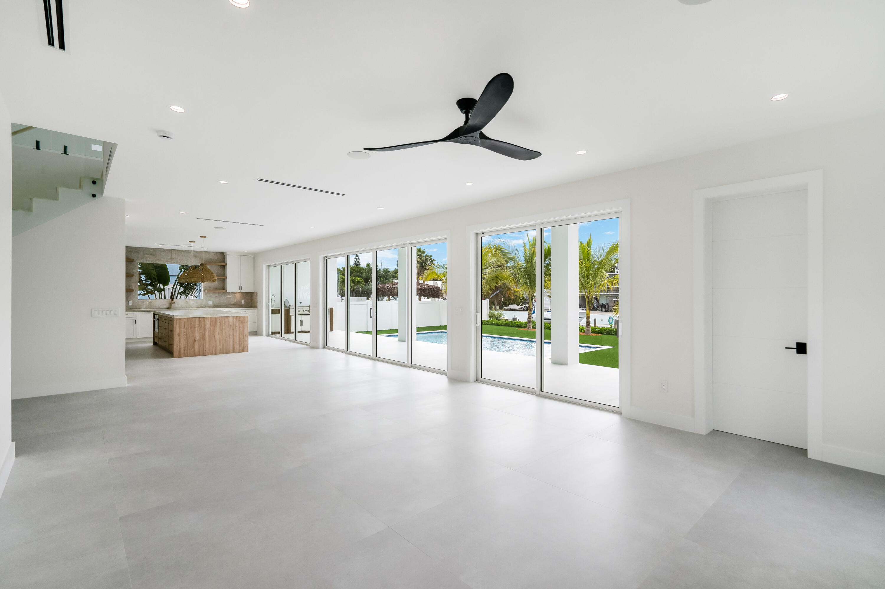 115 Spoonbill Road Tavernier, FL 33070 - Photo 9 of 85 a view of empty room with floor to ceiling window and ceiling fan