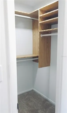 a bathroom with a shower a toilet and sink
