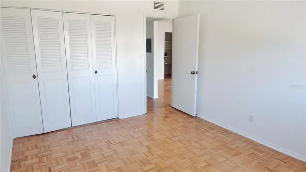 a bathroom with a toilet and a bath tub